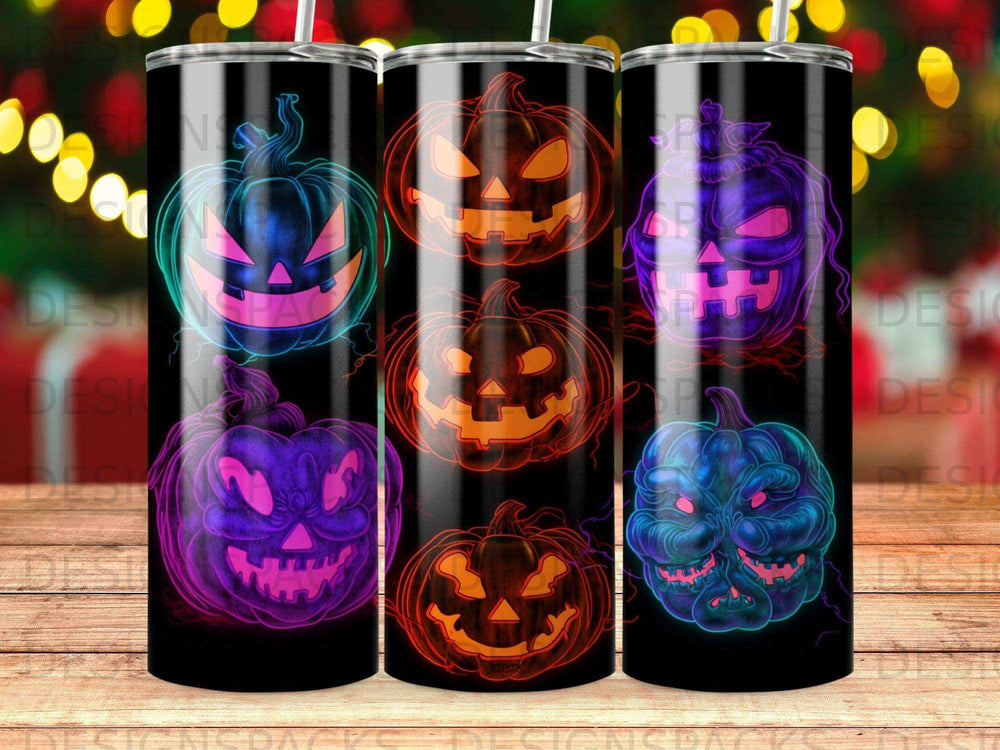 Three tumblers featuring neon jack-o'-lantern designs on a dark background.