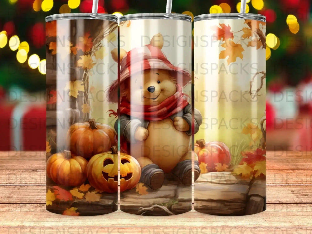 Winnie the Pooh and pumpkins on a fall-themed tumbler.