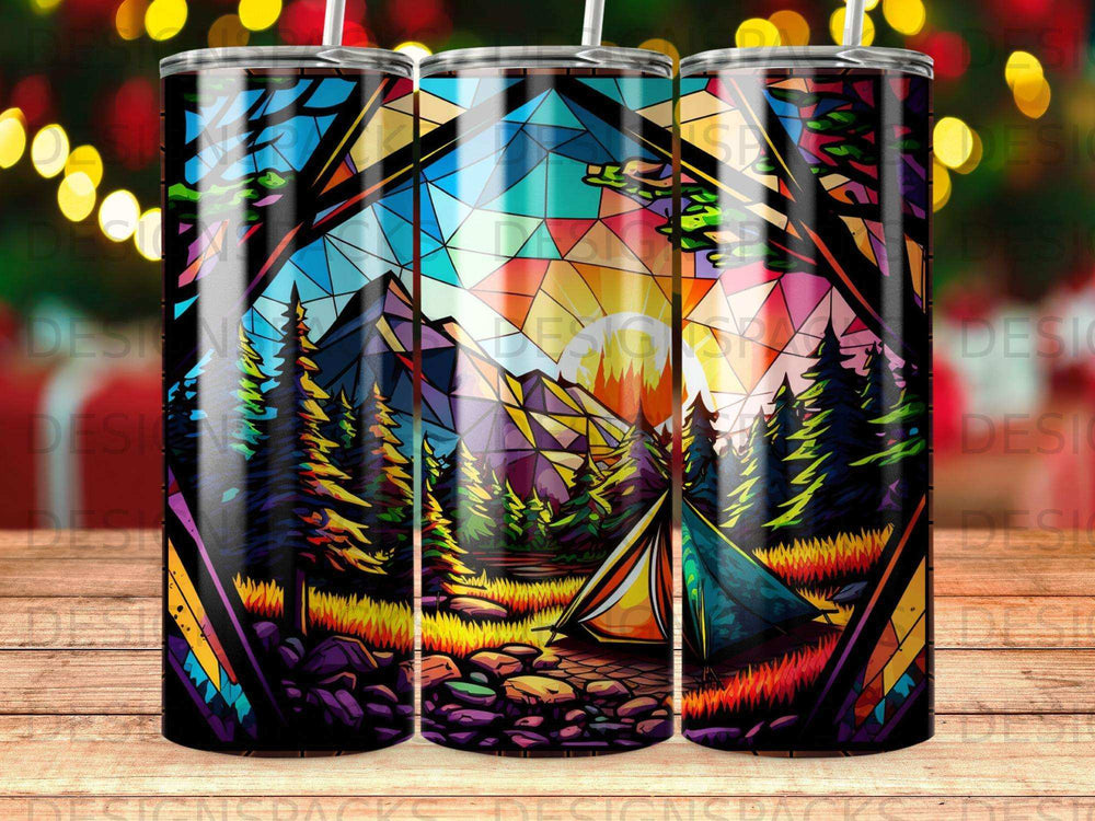 Stained glass scene with tent, mountains, trees, and colorful sky.