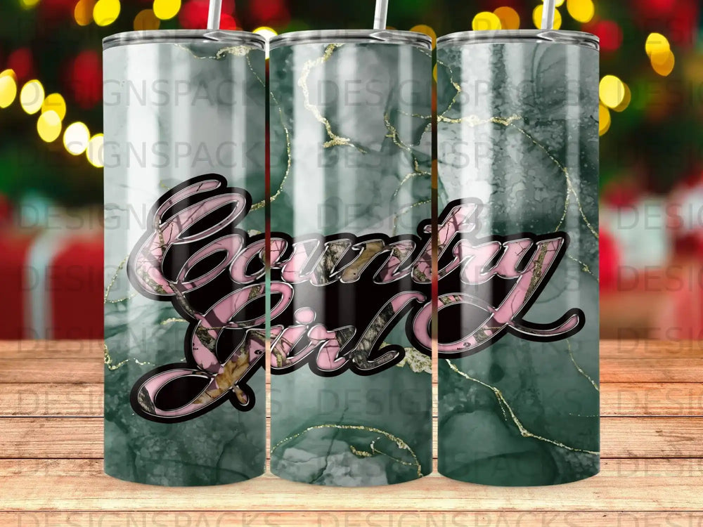 Tumbler with "Country Girl" text in pink camouflage on a marble background.