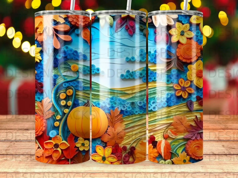 Three tumblers with autumn floral and pumpkin designs.