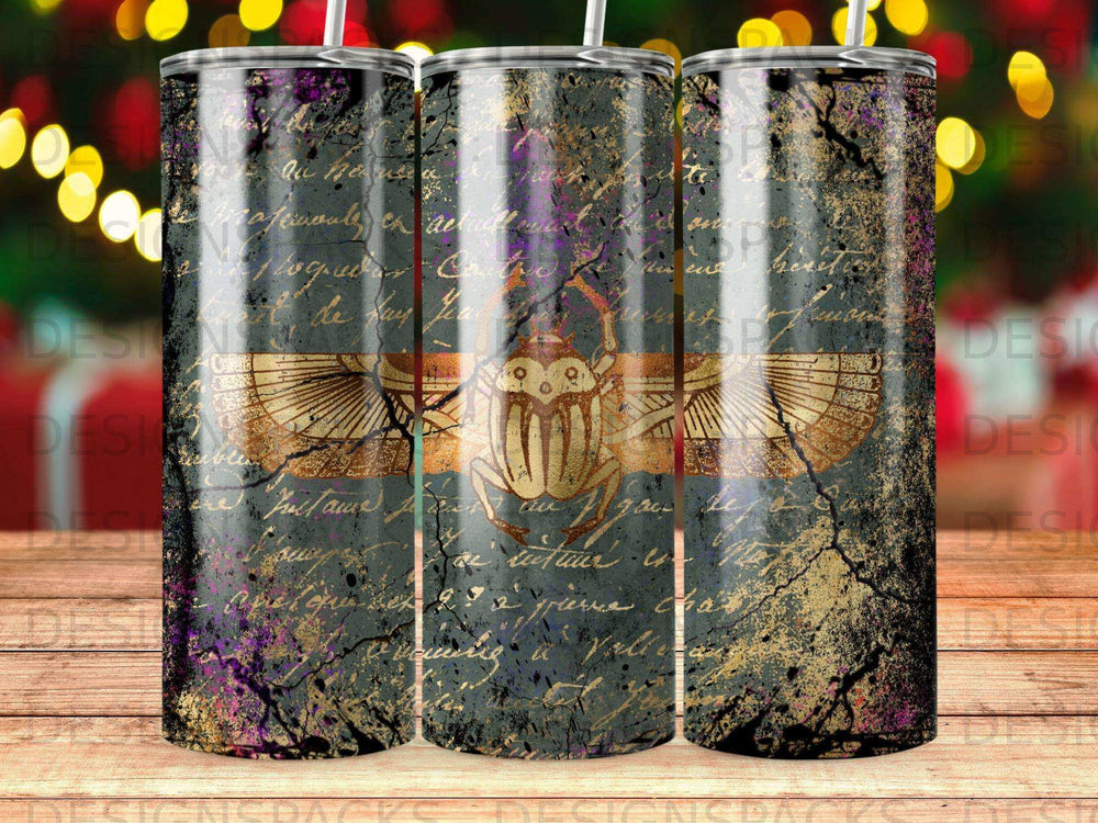Tumbler with Egyptian scarab and distressed antique paper background.