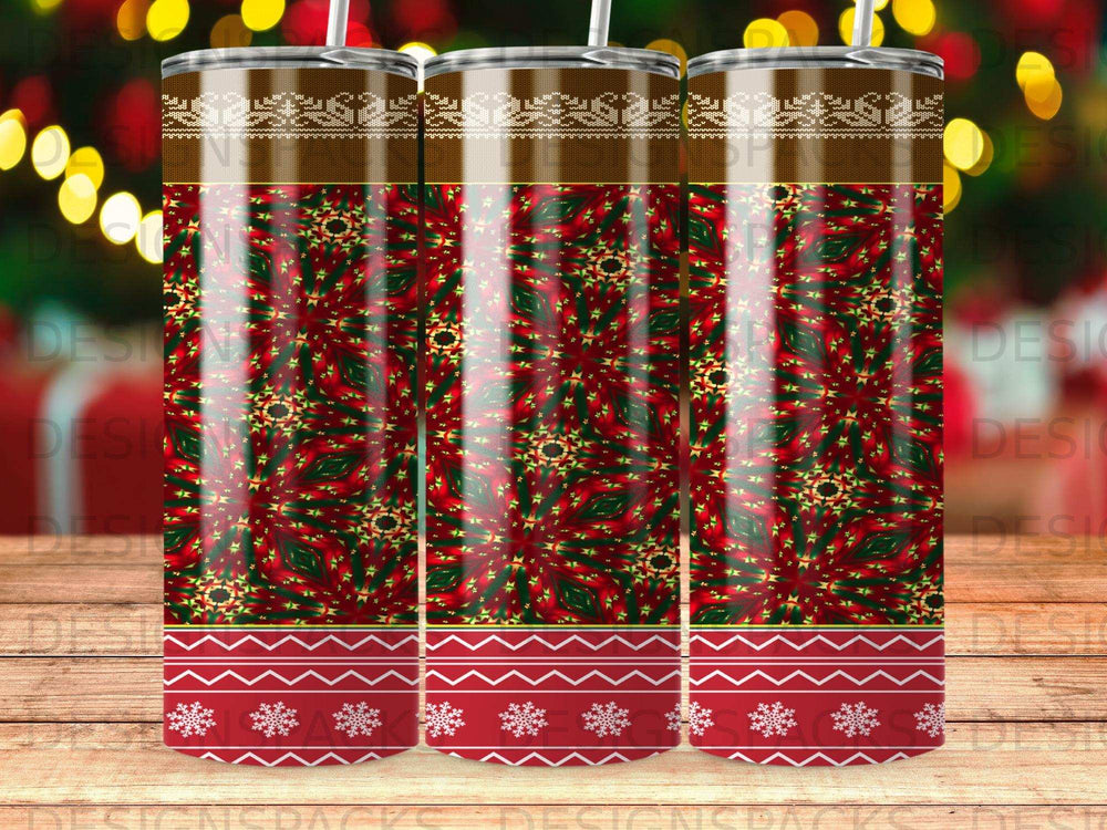 Three tumblers with a repeating red and green snowflake pattern and brown trim.