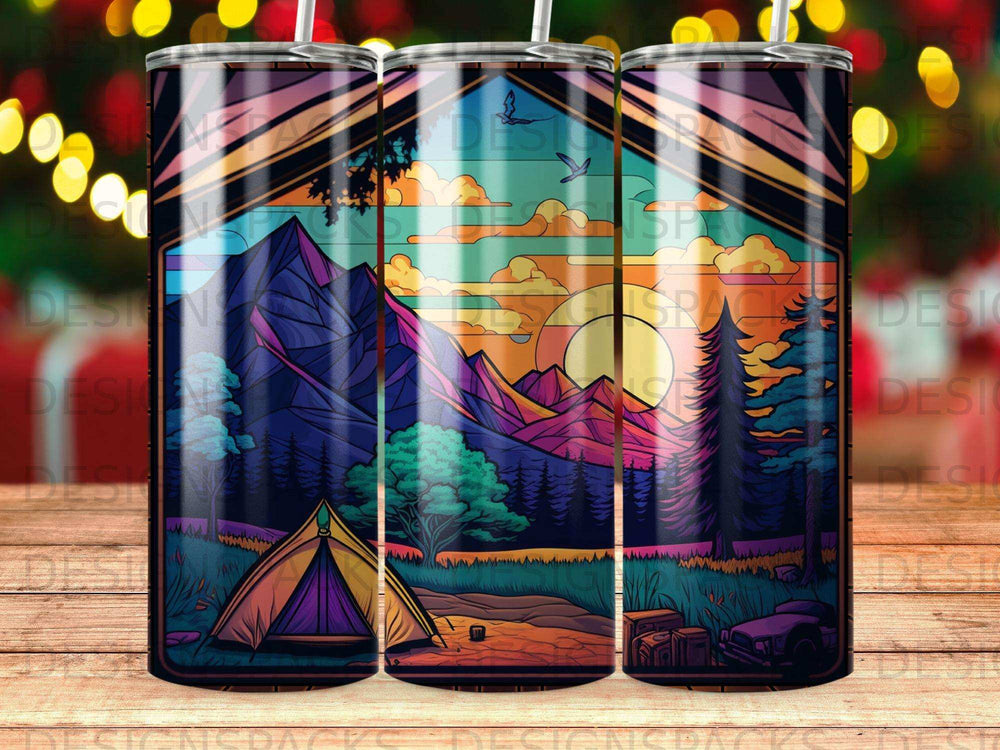Tent and mountains at sunset on a patterned tumbler.