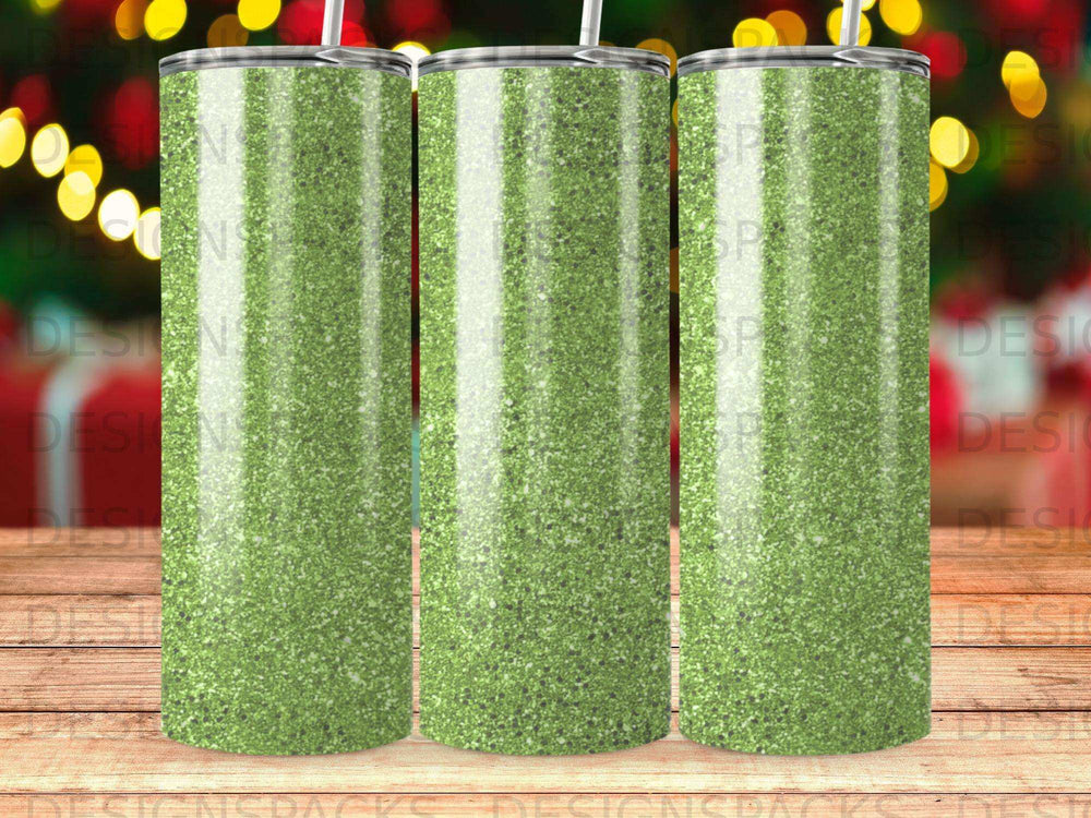 Green glitter tumbler with three identical designs side-by-side.