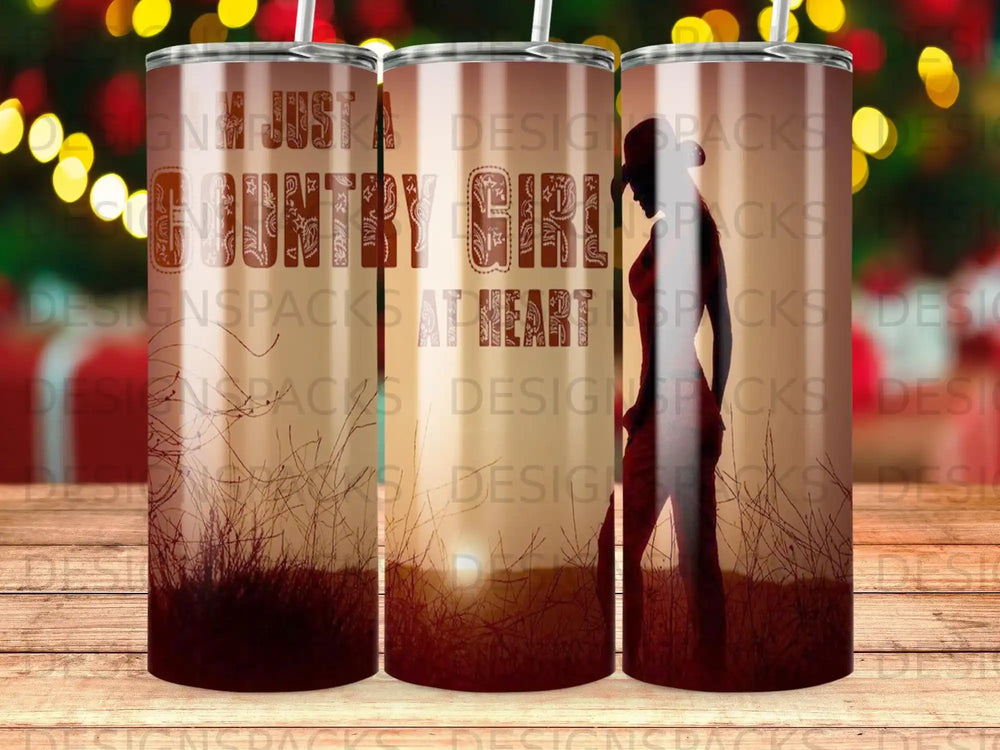 Tumbler with "Country Girl at Heart" text and silhouette of a woman.