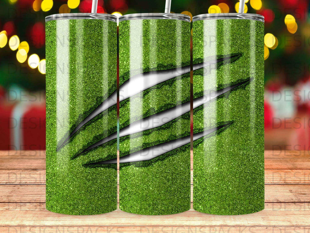 Green glitter tumbler with black claw marks and vertical white stripes.