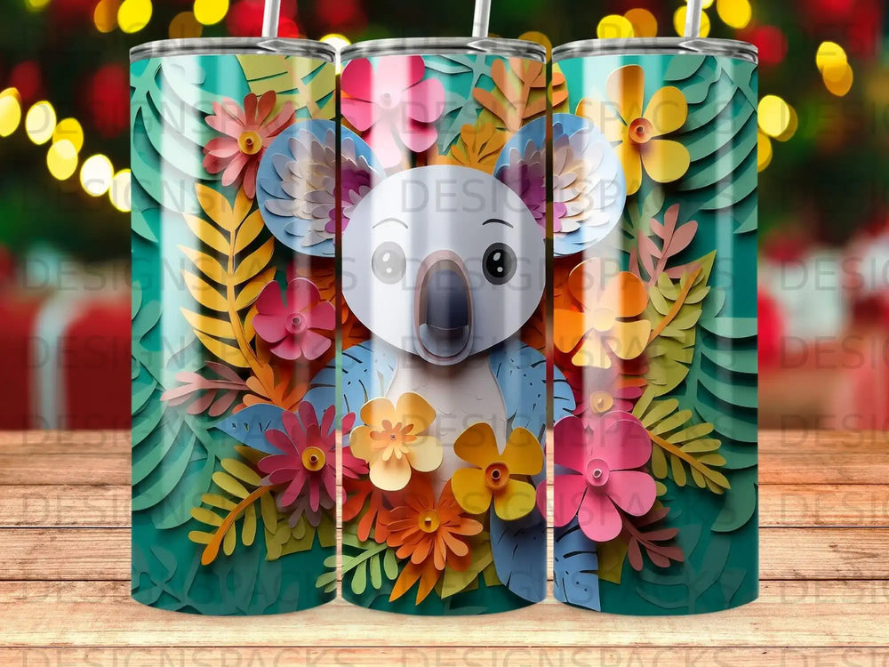 Koala with colorful paper flowers and leaves on a teal background tumbler.