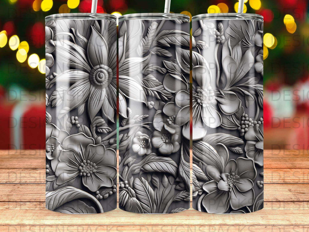 Silver floral embossed tumbler with blurred bokeh background.