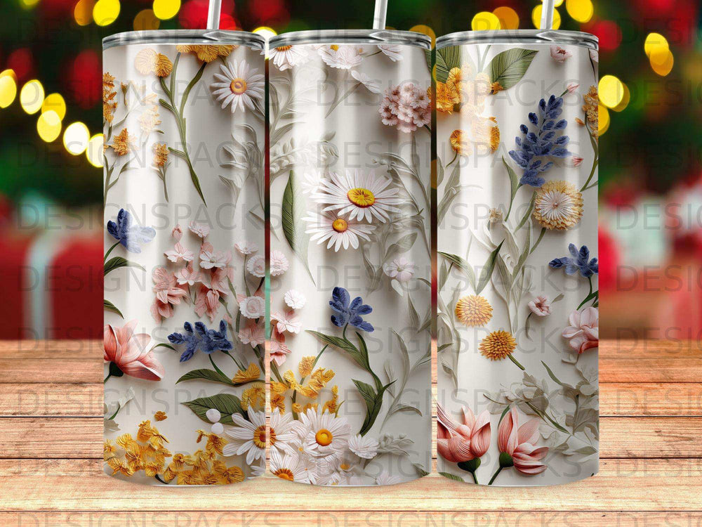 Three tumblers featuring a floral pattern of daisies, lilies, and lavender sprigs.