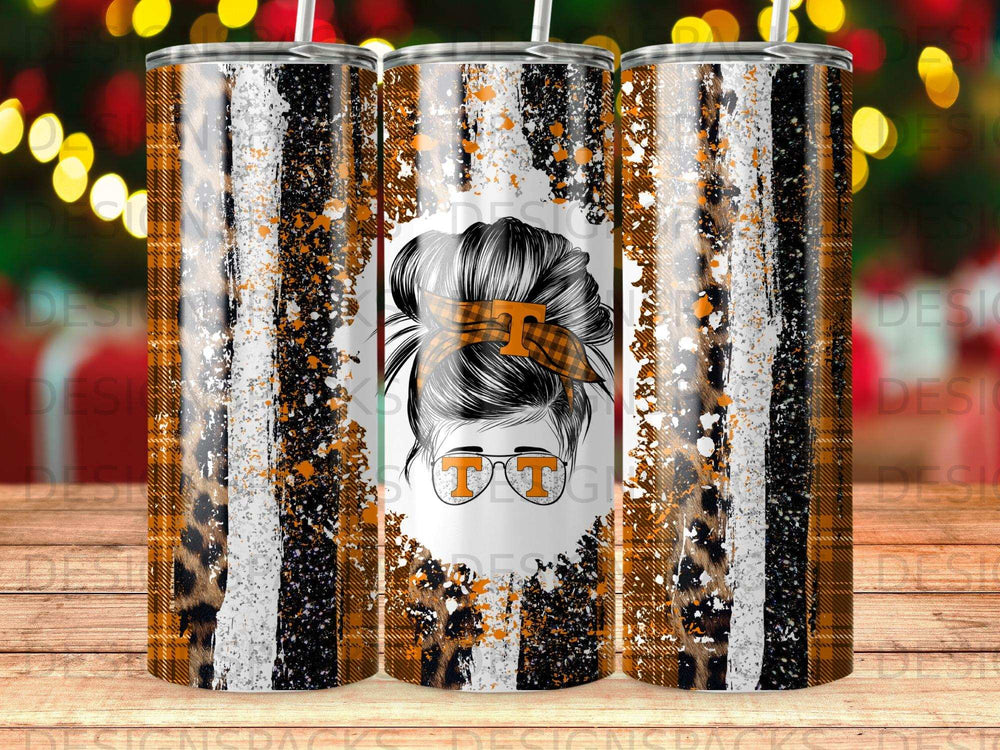 Orange and black plaid tumbler with leopard print and messy bun graphic.