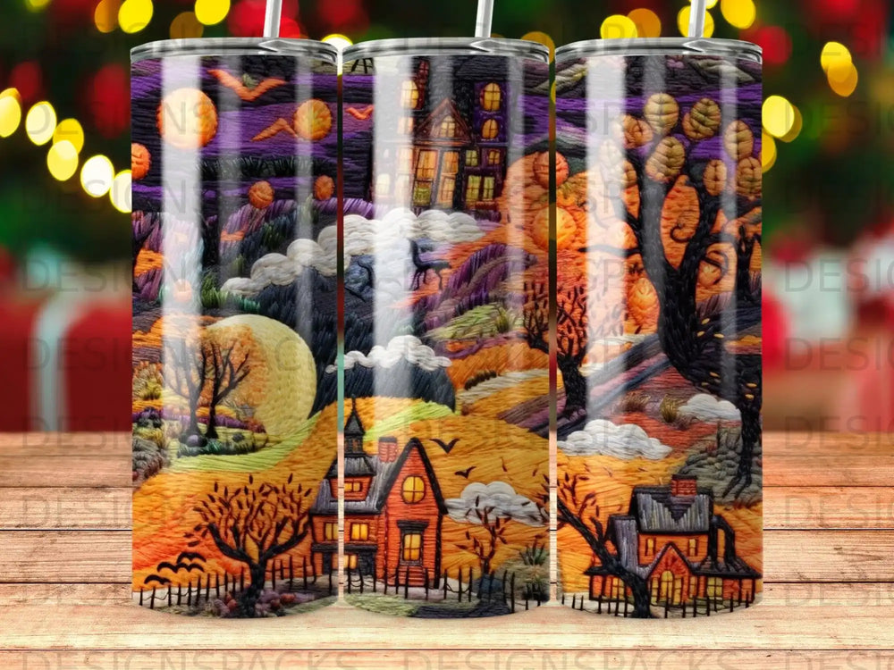 Spooky Halloween scene with haunted houses, moon, and bare trees on a tumbler.