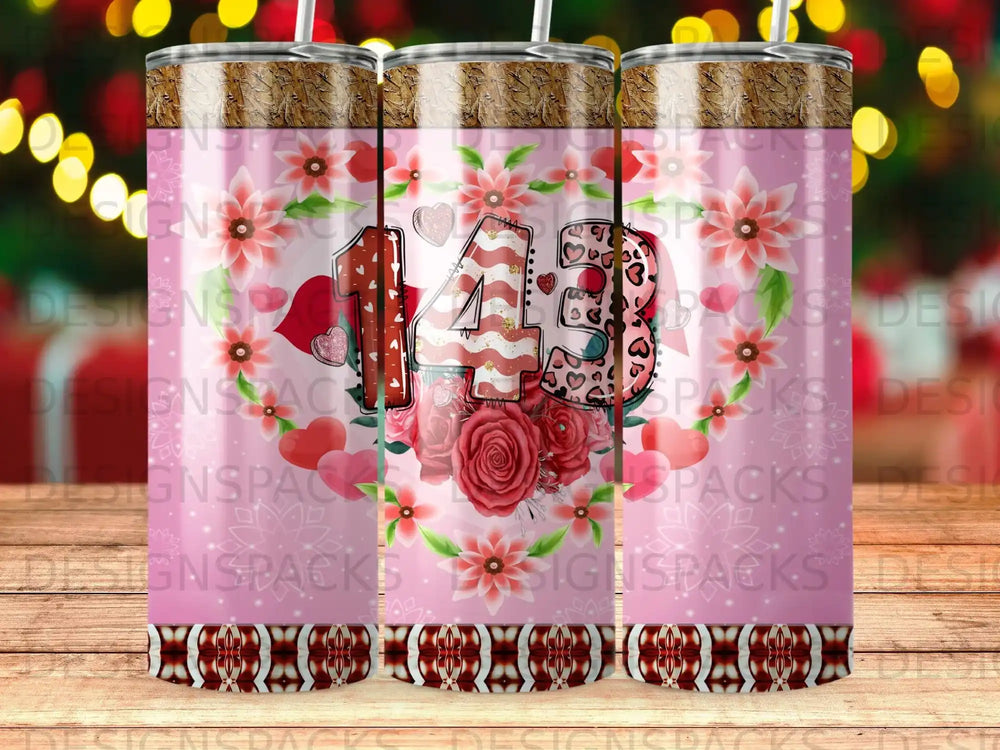 Pink tumbler with floral design and "143" in textured numbers.