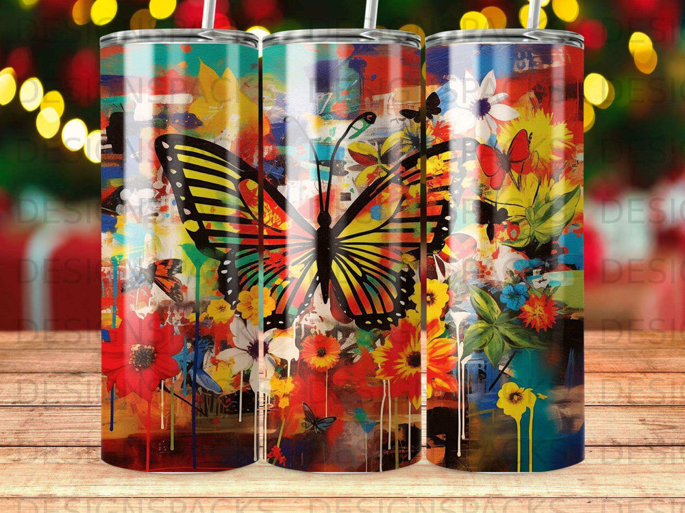 Butterfly and floral art on a tumbler, with vibrant colors and abstract brushstrokes.
