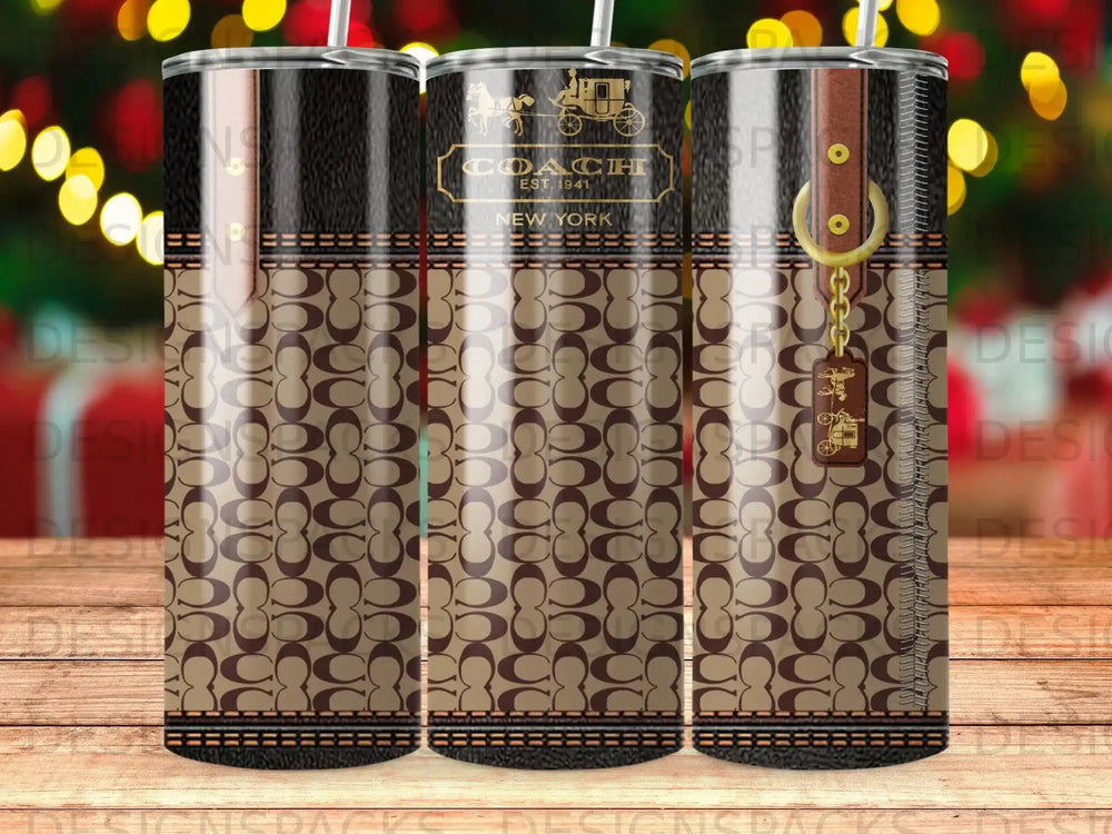 Coach patterned tumbler with gold hardware and "New York" text.