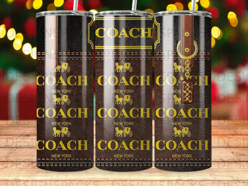 Three COACH New York tumblers with gold hardware and repeating logo pattern.
