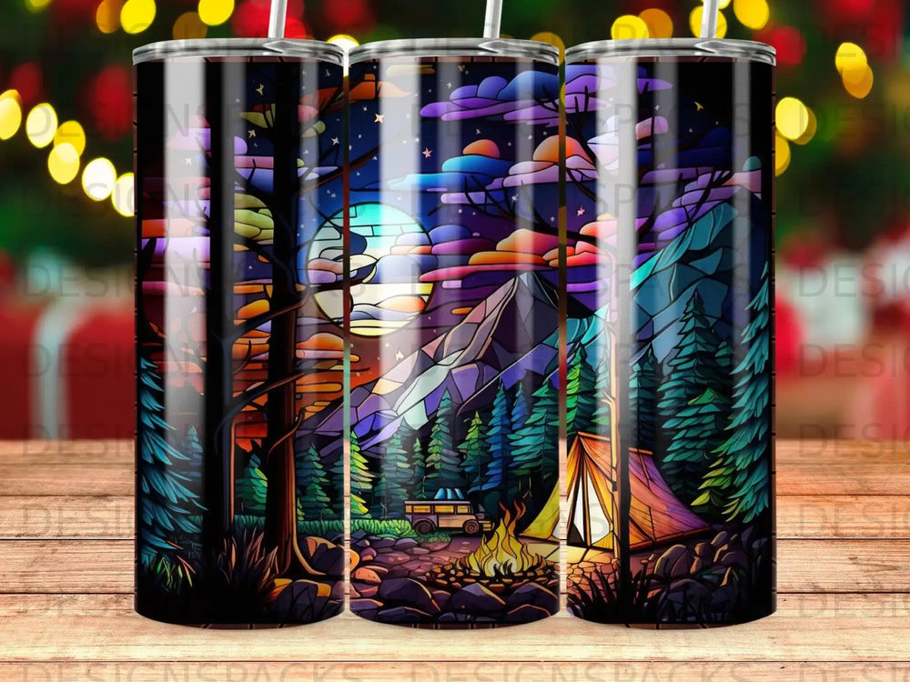 Three tumblers with a stained-glass forest, mountains, and campfire scene.