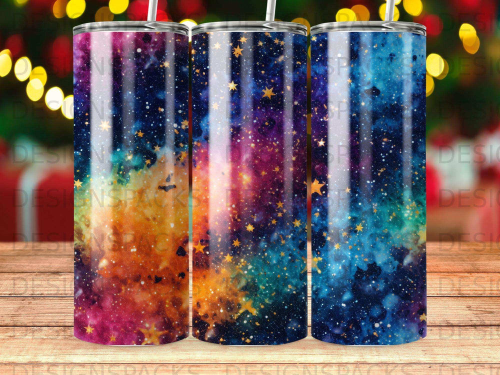 Three tumblers with a colorful galaxy and star pattern.