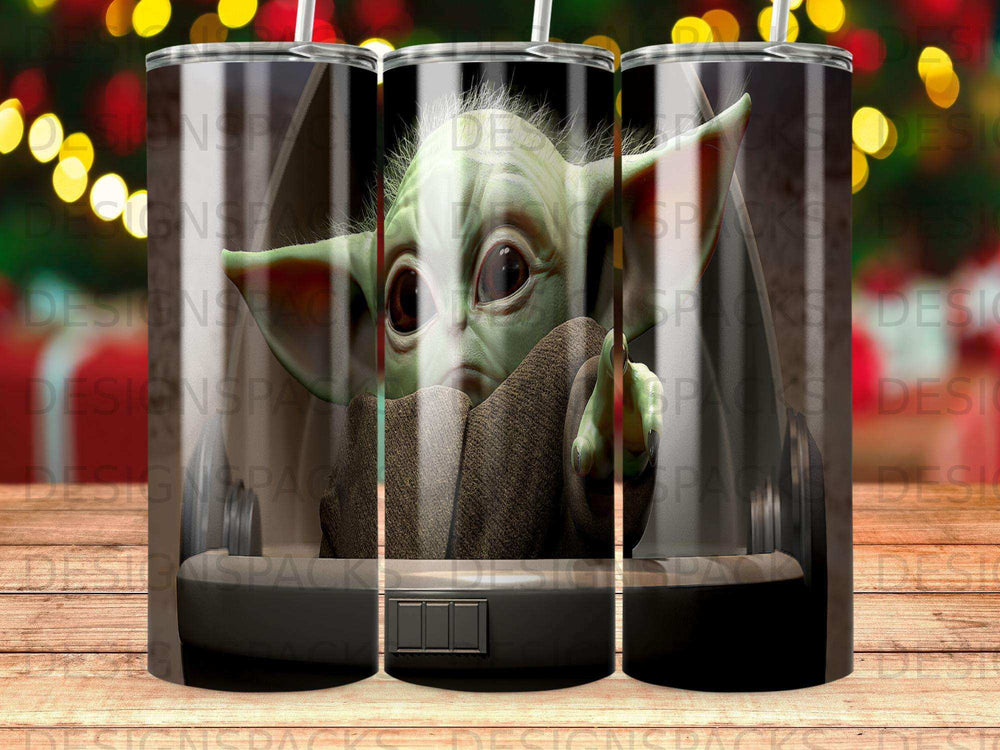 Grogu character in tumbler with a black base and clear body.