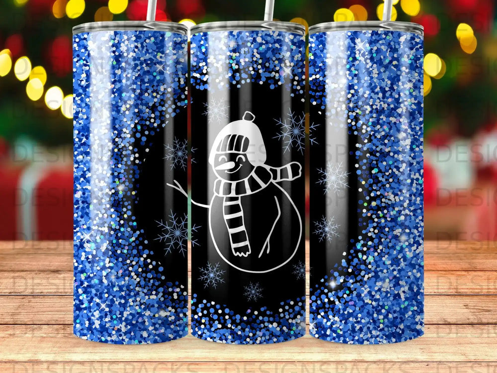 Black tumbler with snowman and blue glitter pattern.