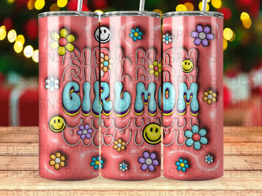Pink tumbler with "Girl mom" text and colorful floral and smiley face designs.