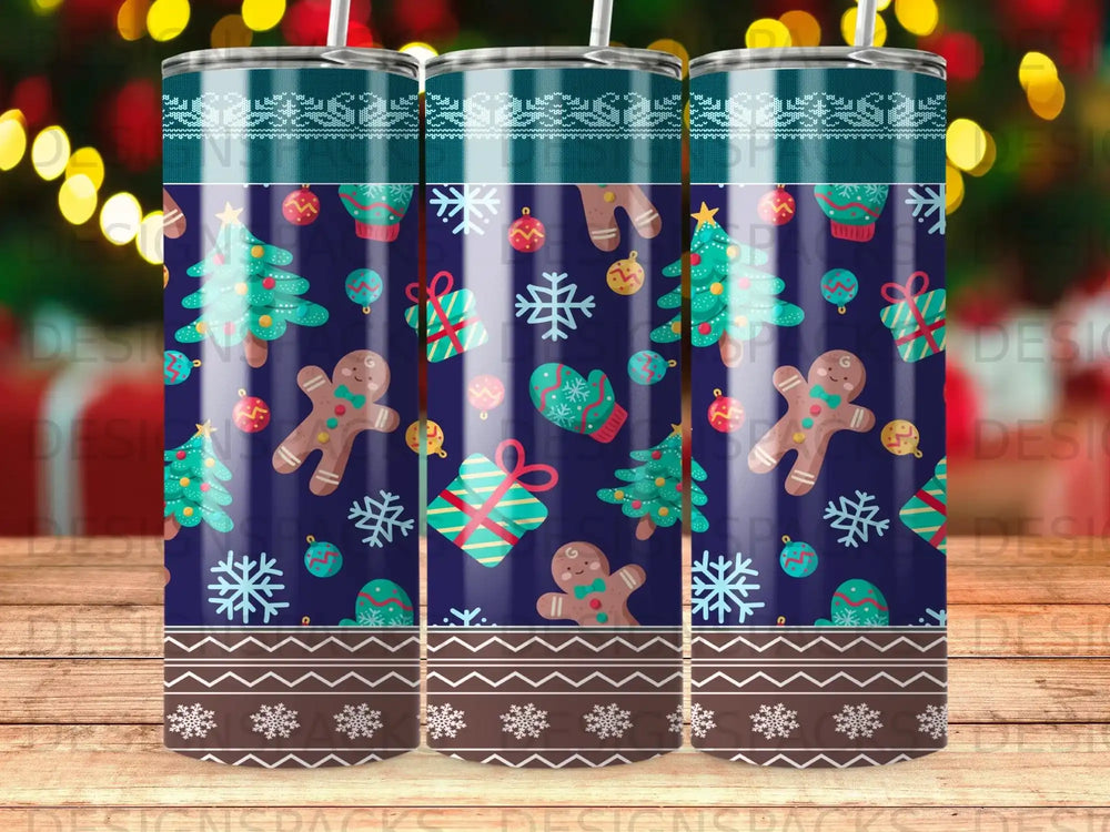 Blue tumbler with gingerbread, Christmas trees, and snowflakes pattern.