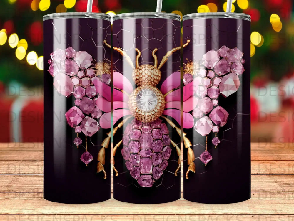 Pink jeweled bee with hexagon pattern on a dark tumbler.