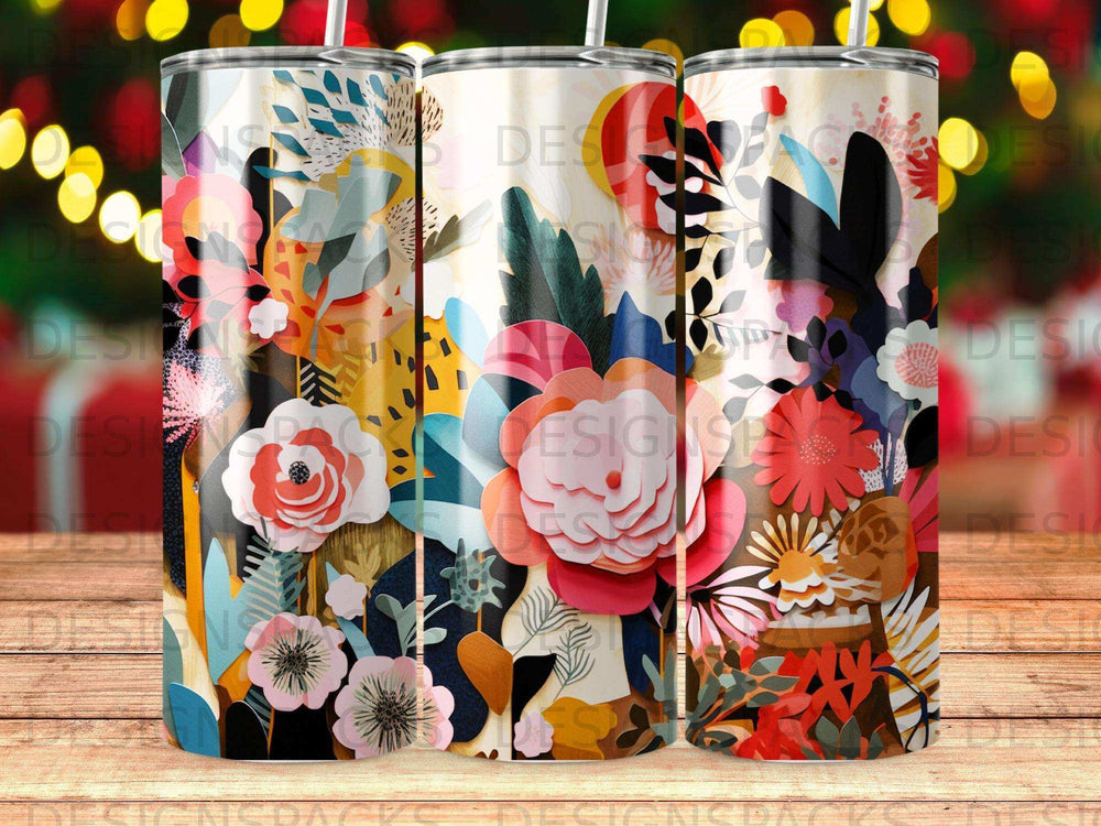 Three tumblers with a colorful floral and abstract pattern.