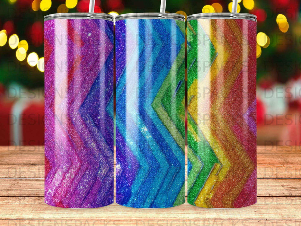 Three glitter tumblers with chevron patterns in purple, blue, and green hues.