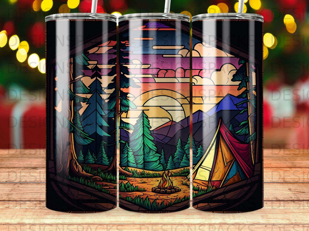 Campfire and tent under sunset mountains and trees, framed by dark wood.
