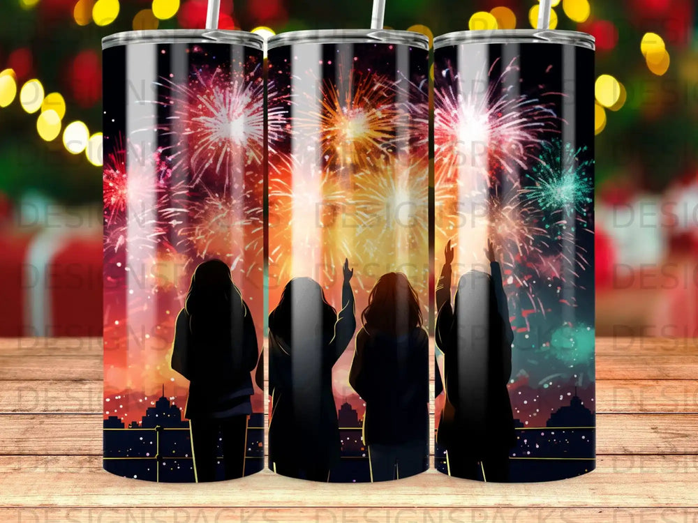 Silhouettes of people watching fireworks over a city skyline.