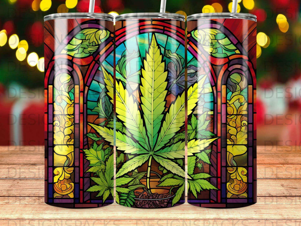 Stained glass tumbler featuring a cannabis leaf against a colorful, arched window.