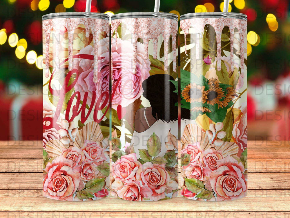 Pink and rose floral design on a tumbler with a woman's silhouette.