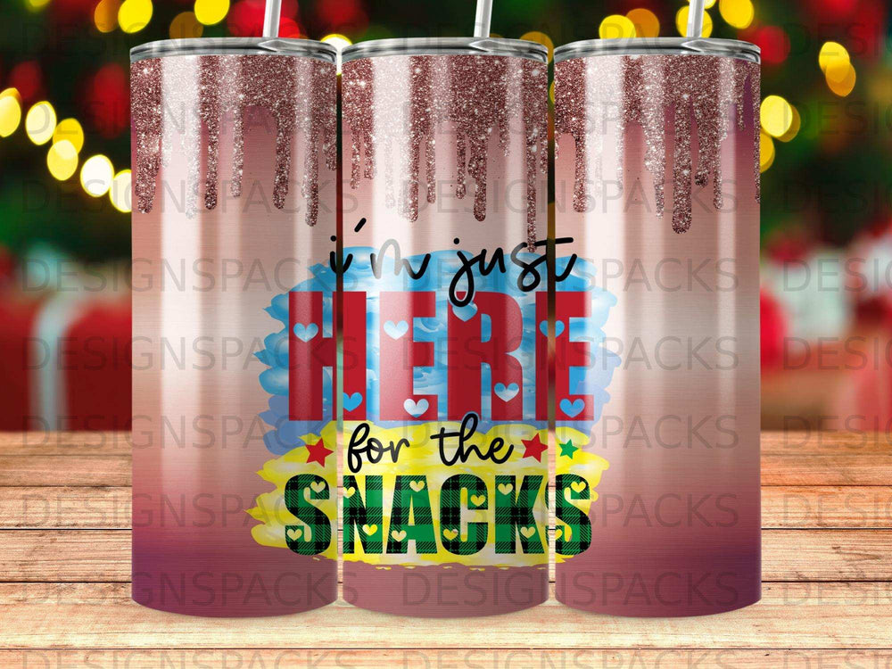 Tumbler with "I'm just here for the snacks" text and glitter accents.