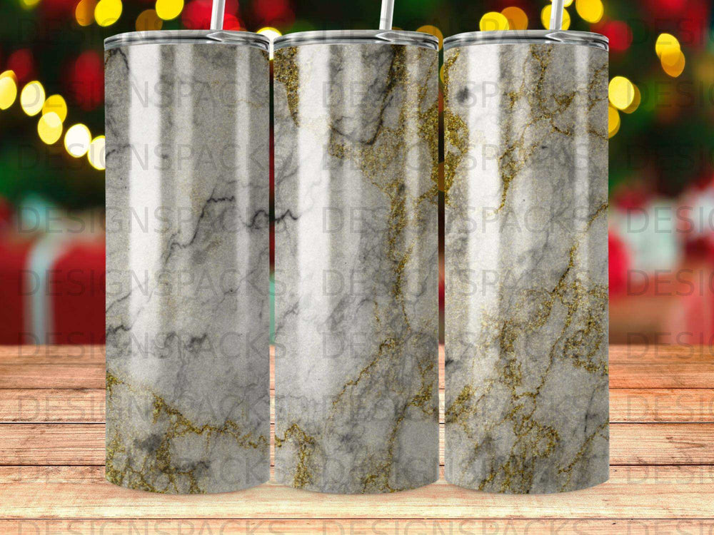 Three tumblers with a marble and gold glitter design.