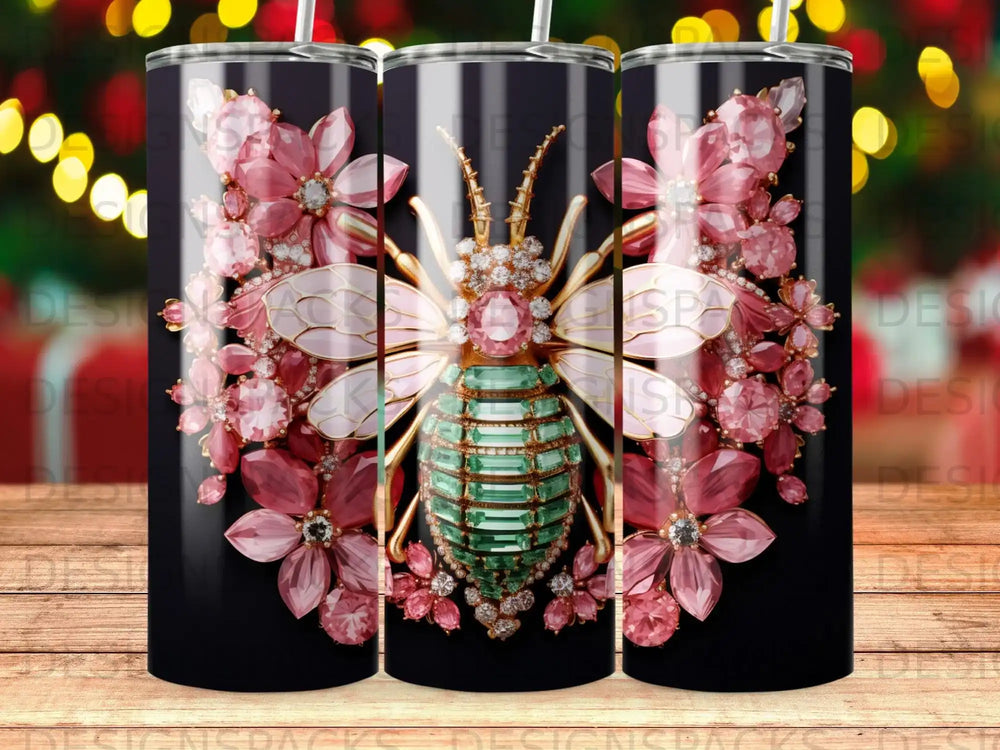 Bee with pink flowers and green gems on a black striped tumbler.