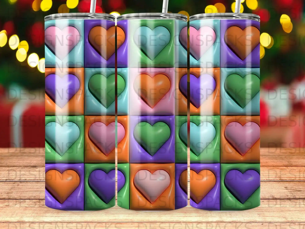 Tumbler with rows of colorful heart shapes on a checkered background.