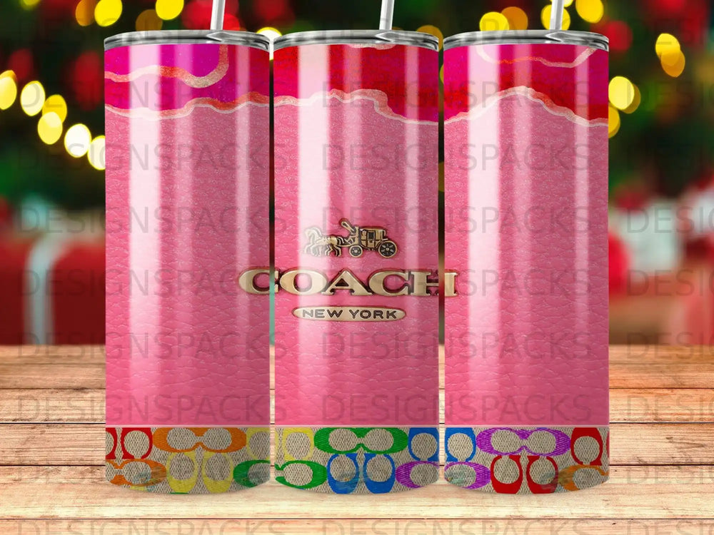 Coach tumbler with pink, gold, and rainbow pattern.