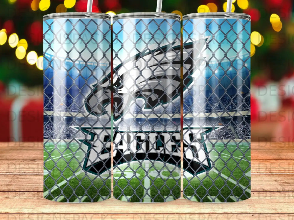 Philadelphia Eagles logo on a football field behind a chain-link fence.