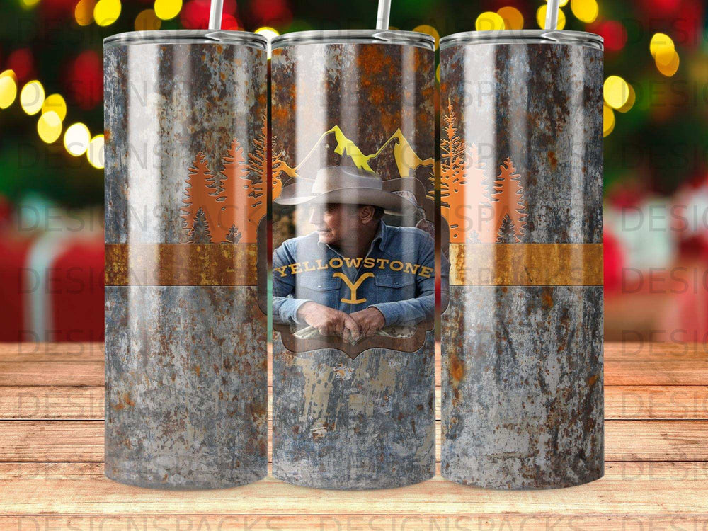 Yellowstone tumbler with cowboy hat, mountains, and trees.