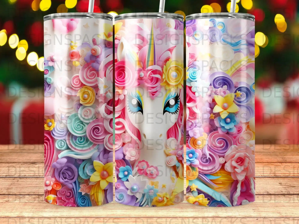 Pink and blue tumbler with colorful flowers and swirls.