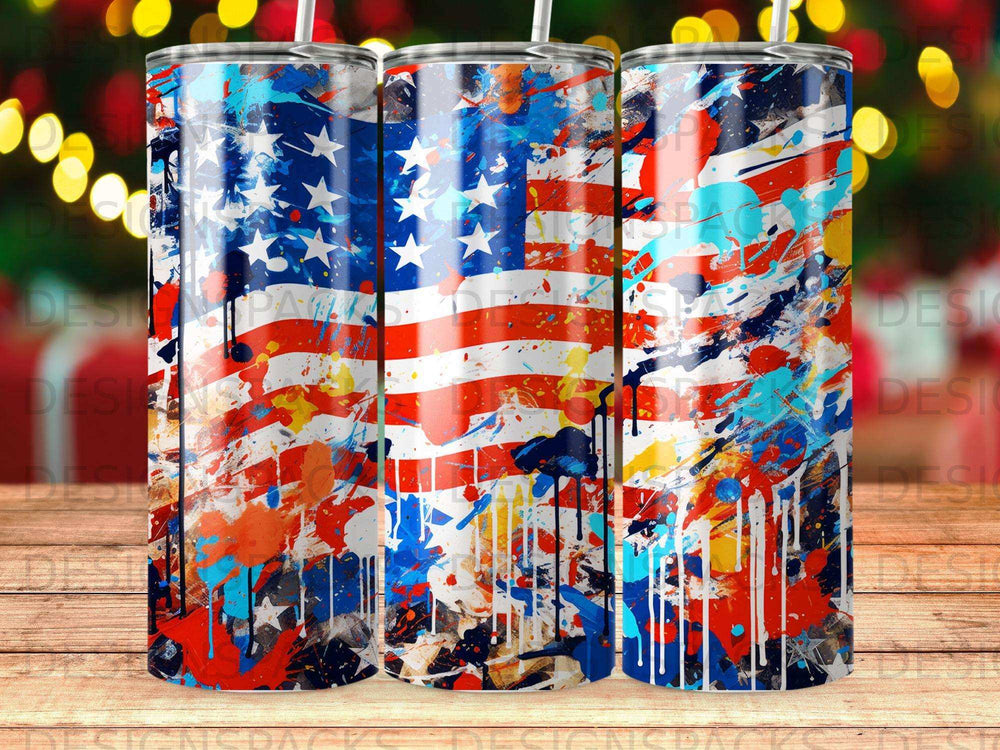 American flag tumbler with colorful paint splatter and bokeh lights background.
