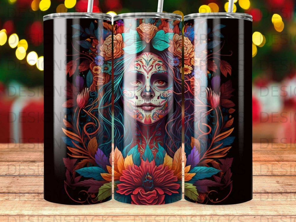 Day of the Dead skull art on a black tumbler surrounded by floral designs.