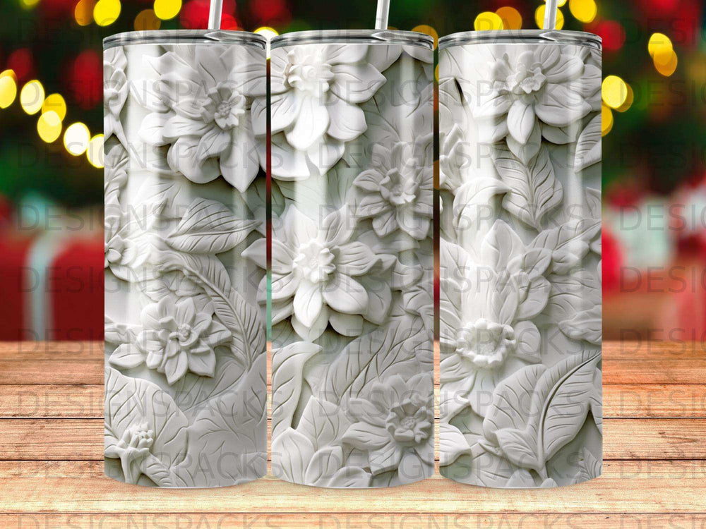 White embossed floral pattern on a tumbler cup.