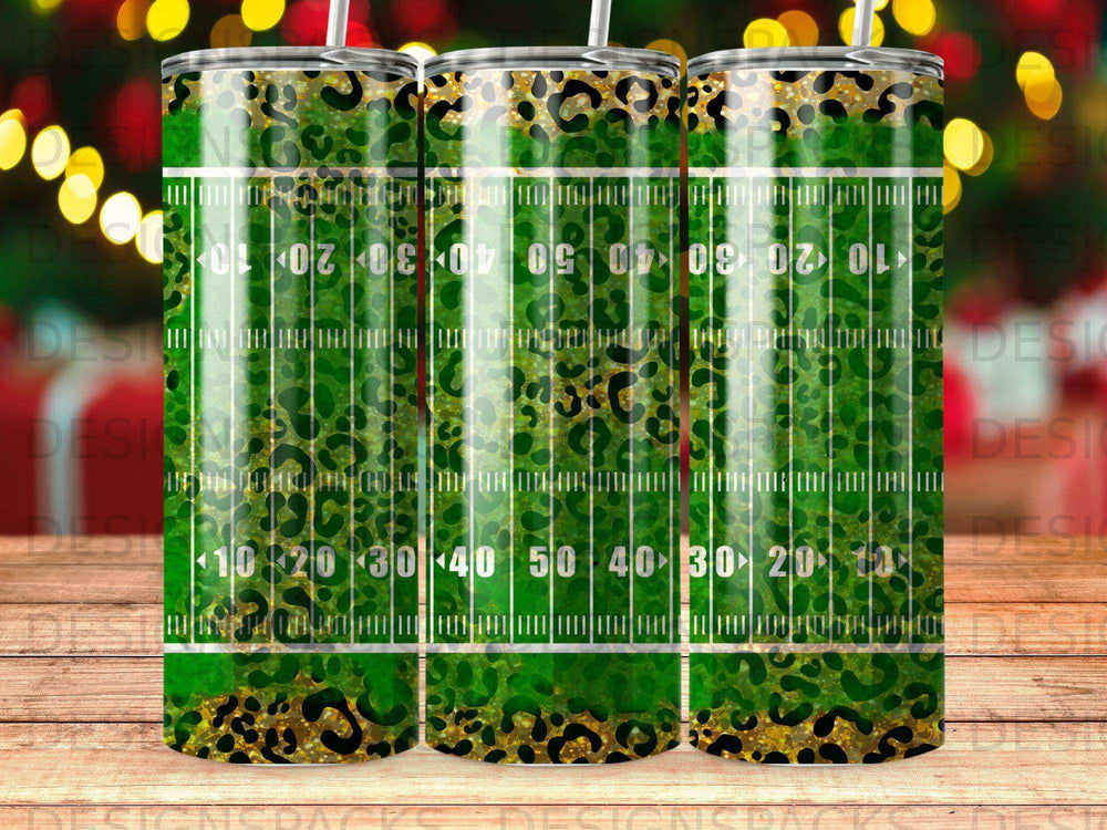 Green leopard print and gold football field tumbler with yard markers.