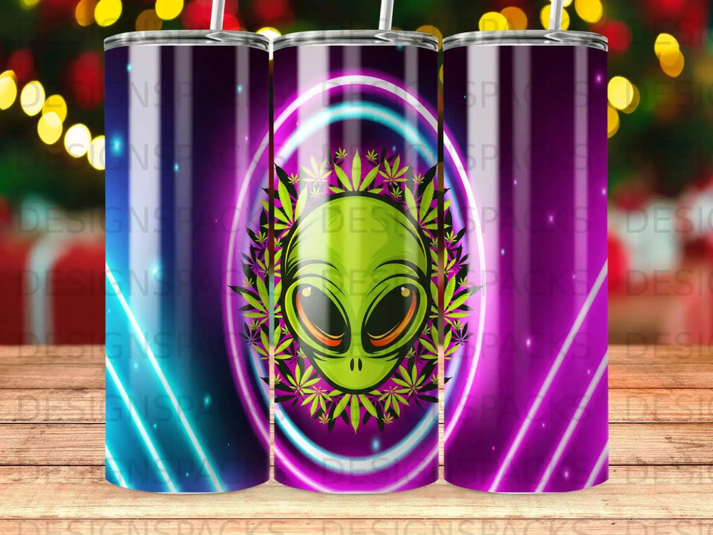 Green alien head with cannabis leaves and purple rings, on a tumbler.