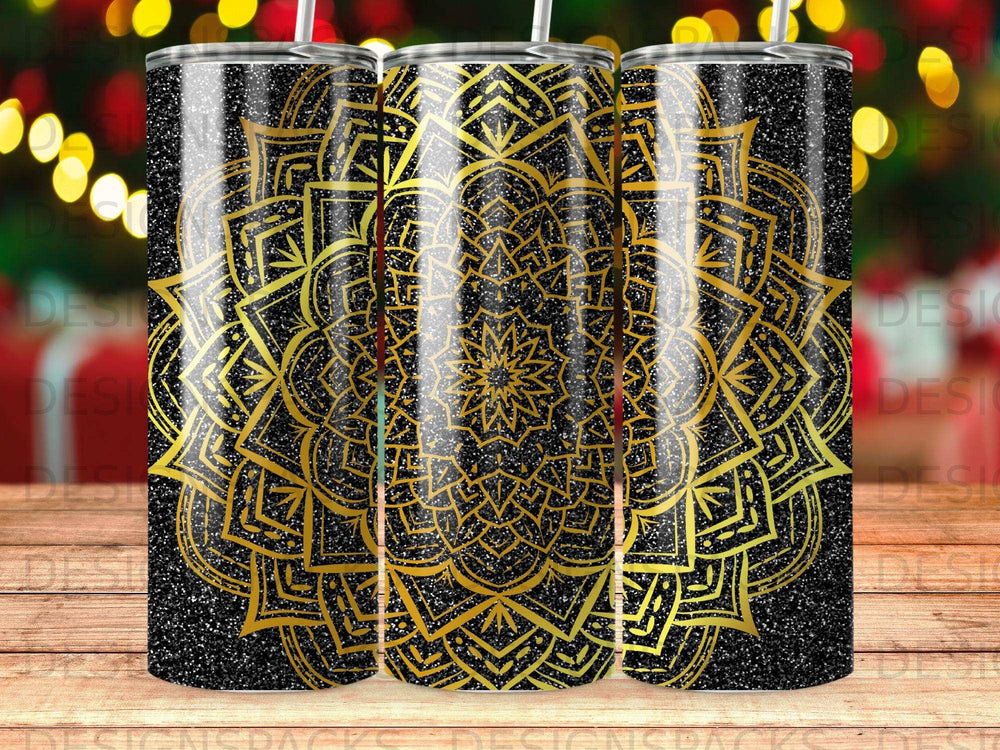 Black tumbler with a gold mandala pattern and glitter accents.