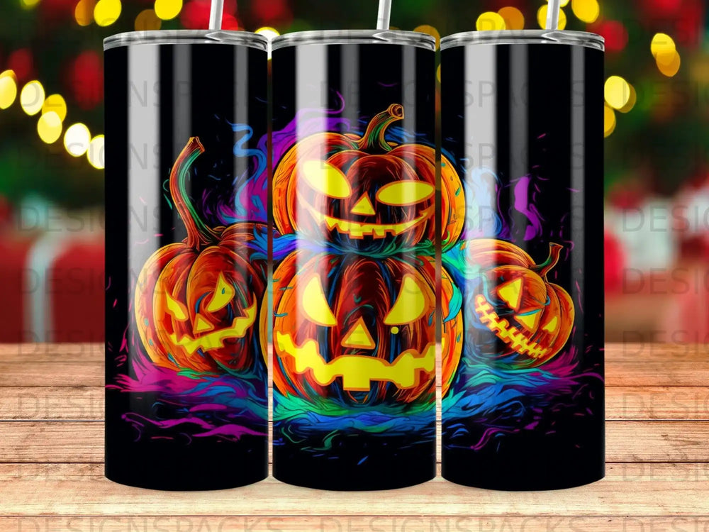 Three jack-o'-lantern pumpkins with spooky faces illuminated by colorful smoke.