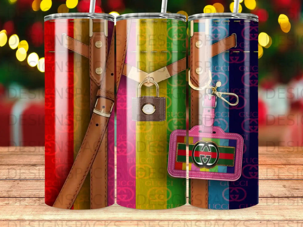 Three tumblers with a Gucci pattern and a luggage tag.