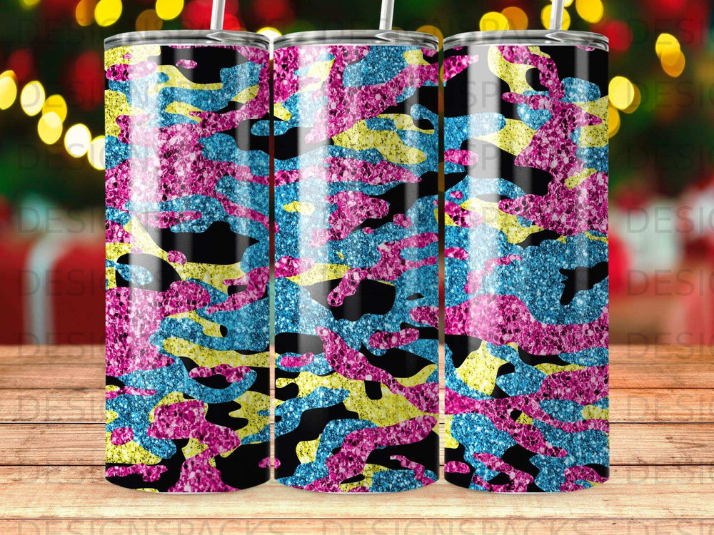 Tumbler with pink, blue, and yellow glitter camouflage pattern.